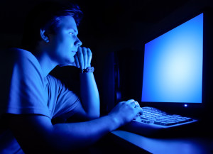 Man in front of computer screen