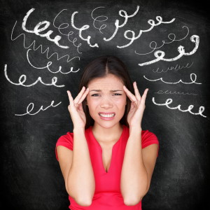 Stress - woman stressed with headache